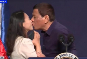 Philippine President Duterte condemned for kissing overseas worker
