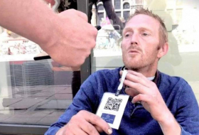 Homeless people are wearing barcodes to encourage more cashless donations