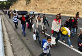 Venezuelans flood into Ecuador, defying passport rules