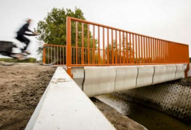 World's first 3D-printed bridge opens to cyclists in Netherlands