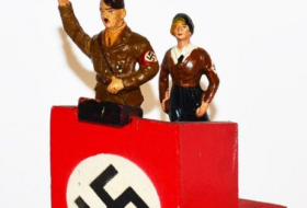 Adolf Hitler action figure with adjustable saluting arm sold at auction