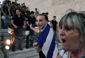 Greek public servants strike over deal