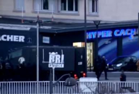 Paris supermarket hostages sue media outlet over siege coverage