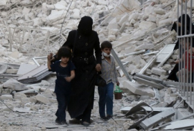 Syria war: White Helmets group says aid center hit by barrel bomb