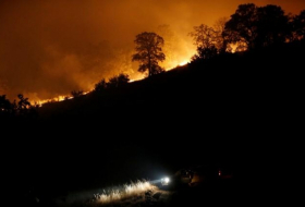 Evacuation orders lifted but California wildfire rages on