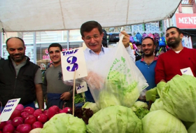 Ahmet Davuto?lu sells vegetables at a weekly Istanbul market - PHOTOS