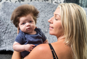 Nine-week-old baby has better hair than you