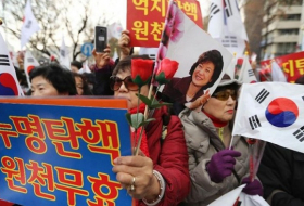 Supporters of impeached SKorean leader clash with protesters 