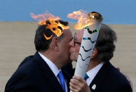 Olympic torch handed over to Brazilians