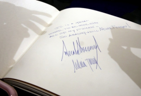 The way President Trump signs guest books is different