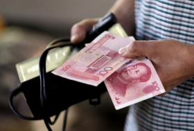 China`s offshore yuan falls to nine-month low vs dollar