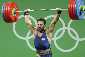 Iran’s weightlifter Rostami takes gold, sets new world record