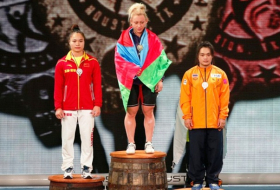 Azerbaijan`s Kostova wins weightlifting gold with world records