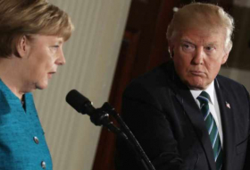 In first Trump-Merkel meeting, awkward body language and a quip - VIDEO