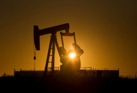Oil stable on weak dollar, economic growth, but pockets of oversupply linger
 