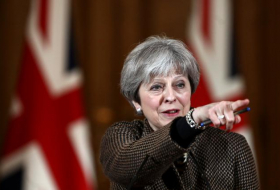 British PM May defends Syria strikes against parliament critics
 
