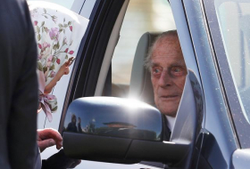 Britain's Prince Philip, 96, drives to horse show, chats with Queen
 