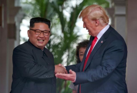 Trump in surprise summit move says he will halt Korea war games
 