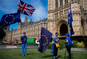 May escapes Brexit bill defeat as Tory rebels accept concessions