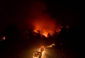 California wildfire nears interstate highway as families flee blaze