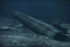 Norway burying Nazi submarine in sand to stem leak of toxic chemicals - PHOTOS