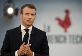 Under pressure, France's Macron delays cabinet reshuffle