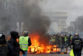   Rioters set fire to a bank and ransack luxury shops in central Paris-  NO COMMENT    