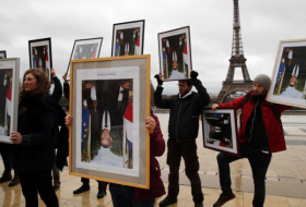  French climate activists hold stolen Macron portraits at protest-  NO COMMENT  
