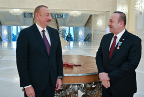  President Ilham Aliyev awards “Dostlug” Order to Turkish FM - VIDEO