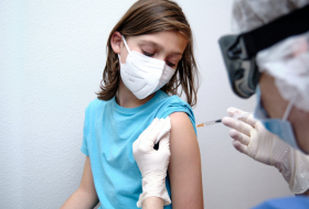 COVID-19 vaccine mandates for kids should be last resort - WHO 