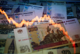 Rouble reverses rally as Russia eases capital controls