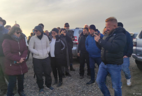   International travelers visit mass graves in Fuzuli  