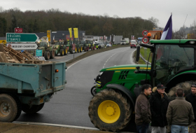   French farmers edge closer to Paris as protests ratchet up pressure on President Macron  