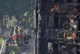 British PM May faces mounting criticism over London tower block blaze