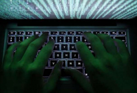 Cyber attack eases, hacking group threatens to sell code