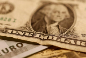 Dollar inches lower as attention turns to Fed