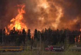 Over 14,000 people evacuated in western Canada over wildfires