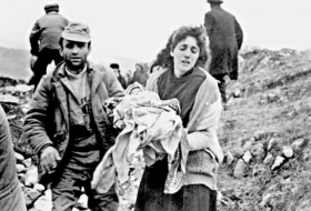 Denial of War Crimes: The Perspective of a Survivor