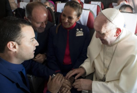 Wing and a prayer: pope marries couple on plane over Chile