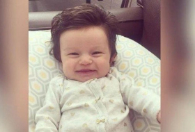 Epic baby goes viral after being born with a full head of thick hair 